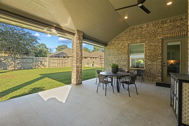 view of patio featuring ceiling fan, outdoor dining area, and a fenced backyard