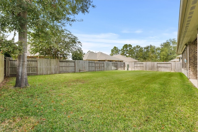 view of yard featuring a fenced backyard