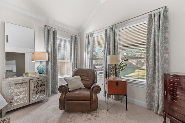 sitting room featuring vaulted ceiling, ornamental molding, baseboards, and light colored carpet