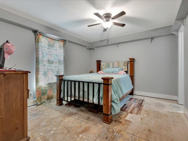 bedroom with baseboards and a ceiling fan