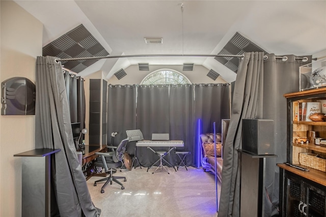 interior space with visible vents, lofted ceiling, and carpet floors