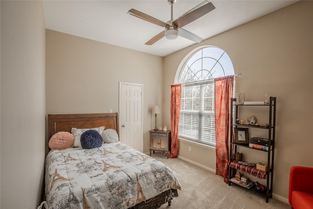 bedroom featuring baseboards, ceiling fan, and carpet flooring