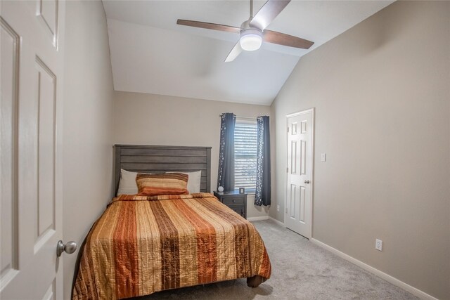 bedroom with lofted ceiling, carpet flooring, a ceiling fan, and baseboards