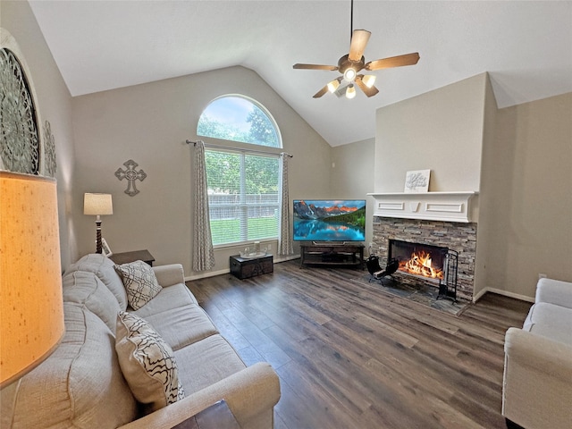 living room with ceiling fan, a fireplace, vaulted ceiling, and wood finished floors