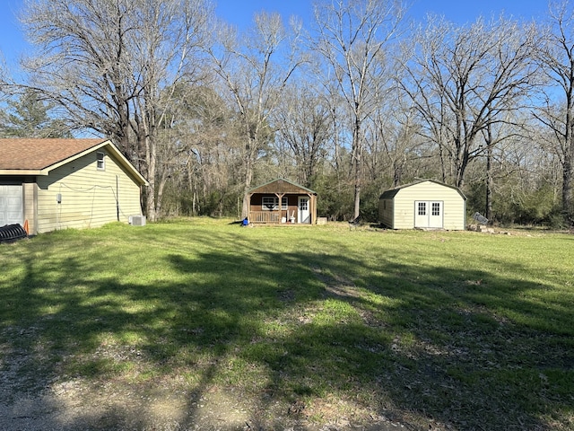 1030 Mangum Rd, Livingston, TX 77351 - view of grassy yard with a storage unit