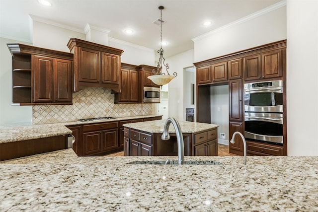 kitchen with stainless steel appliances, a sink, dark brown cabinets, open shelves, and decorative light fixtures