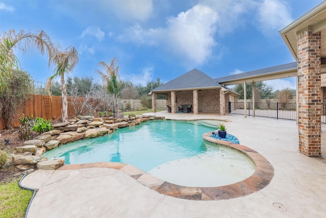 view of pool featuring a fenced backyard, a fenced in pool, and a patio