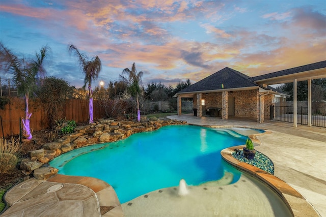 view of swimming pool featuring a fenced in pool, a patio area, and a fenced backyard