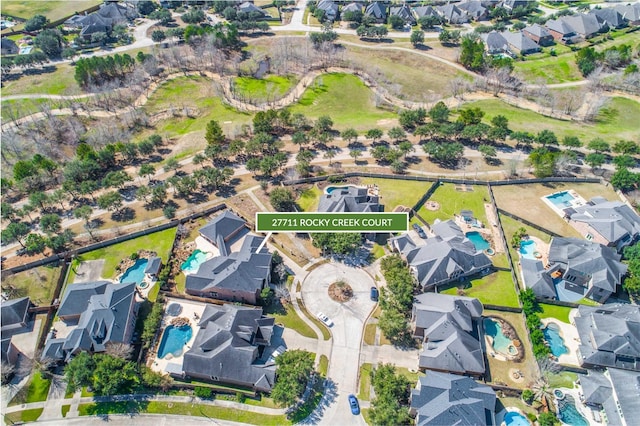 birds eye view of property with a residential view