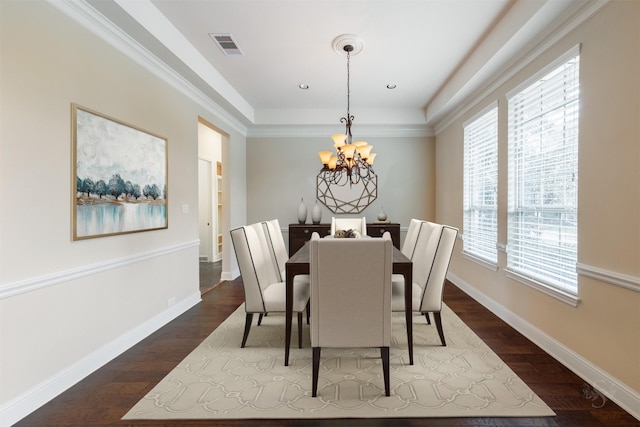 dining area featuring baseboards, a notable chandelier, visible vents, and dark wood-type flooring