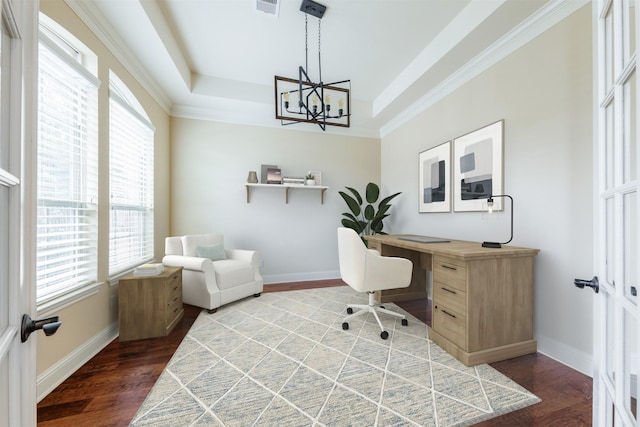 office area featuring a tray ceiling, an inviting chandelier, wood finished floors, and baseboards