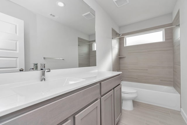 full bathroom featuring visible vents, shower / bathing tub combination, vanity, and toilet