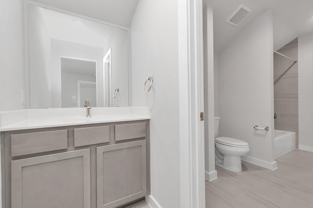 full bathroom with toilet, vanity, visible vents, baseboards, and  shower combination