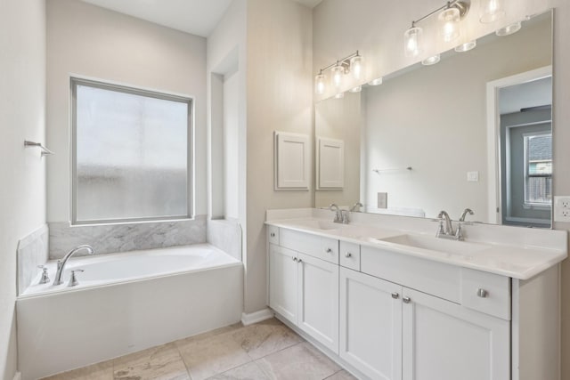 full bath featuring double vanity, a garden tub, and a sink