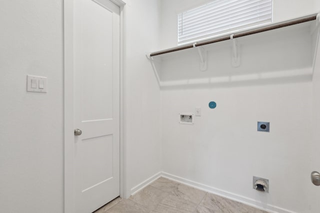 laundry room featuring hookup for a washing machine, laundry area, baseboards, marble finish floor, and electric dryer hookup