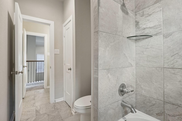 full bathroom featuring marble finish floor, shower / bathing tub combination, toilet, and baseboards