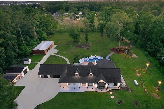 bird's eye view featuring a forest view