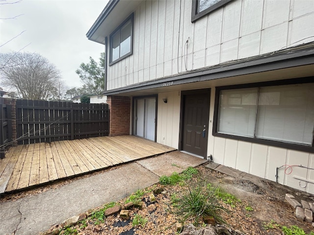 exterior space featuring fence and a wooden deck