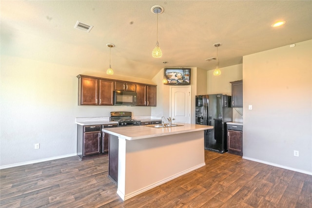 kitchen with dark brown cabinetry, black appliances, a center island with sink, and light countertops