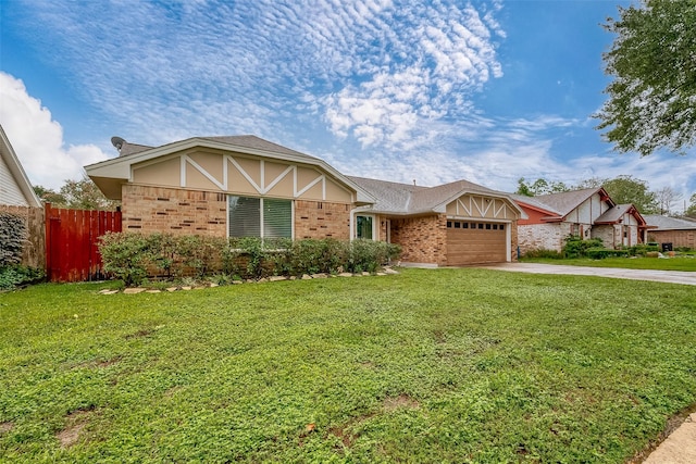 view of front of house featuring stucco siding, an attached garage, a front yard, fence, and driveway