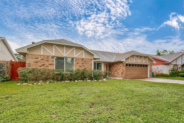 view of front facade featuring a garage, driveway, fence, a front lawn, and brick siding