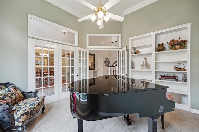 playroom featuring french doors, carpet flooring, and crown molding