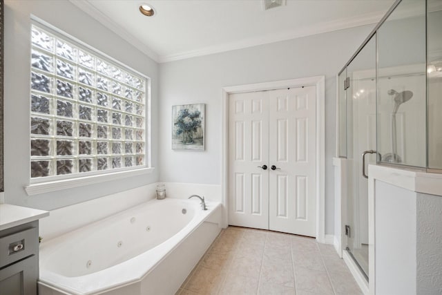 bathroom with a stall shower, tile patterned flooring, crown molding, and vanity