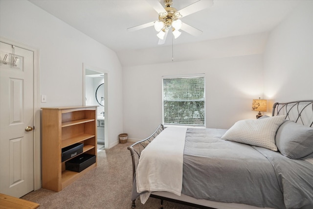 bedroom featuring a ceiling fan, light carpet, vaulted ceiling, and baseboards