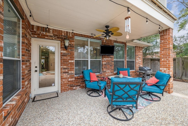 view of patio / terrace featuring ceiling fan, fence, and outdoor dining space