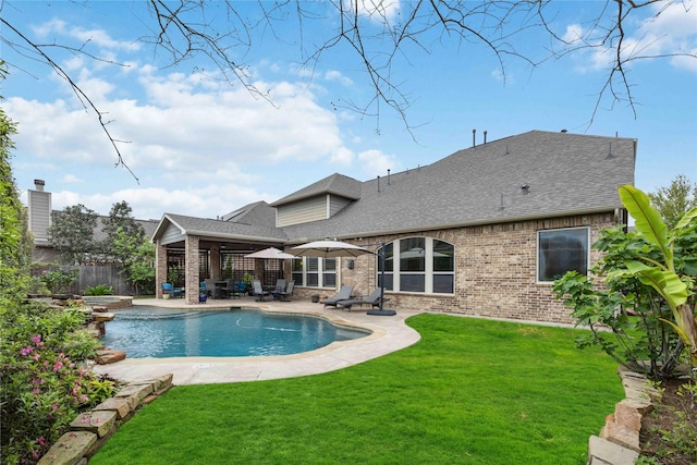 view of pool featuring a patio, a fenced in pool, fence, and a lawn