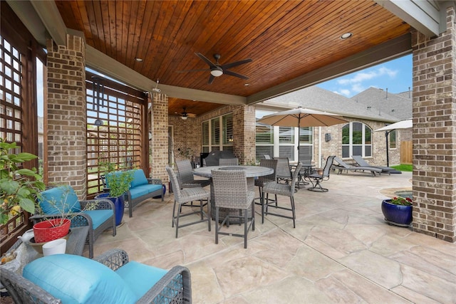 view of patio featuring outdoor dining space, a ceiling fan, and an outdoor hangout area