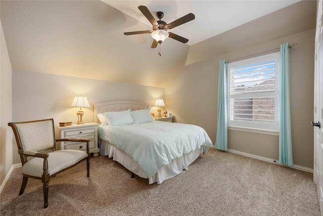 carpeted bedroom featuring ceiling fan, baseboards, and lofted ceiling