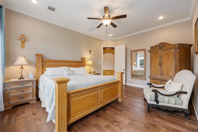 bedroom with crown molding, visible vents, baseboards, and dark wood finished floors
