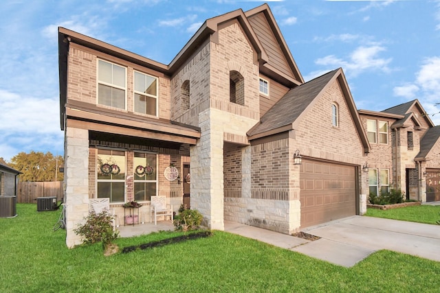 view of front facade featuring brick siding, covered porch, stone siding, driveway, and a front lawn