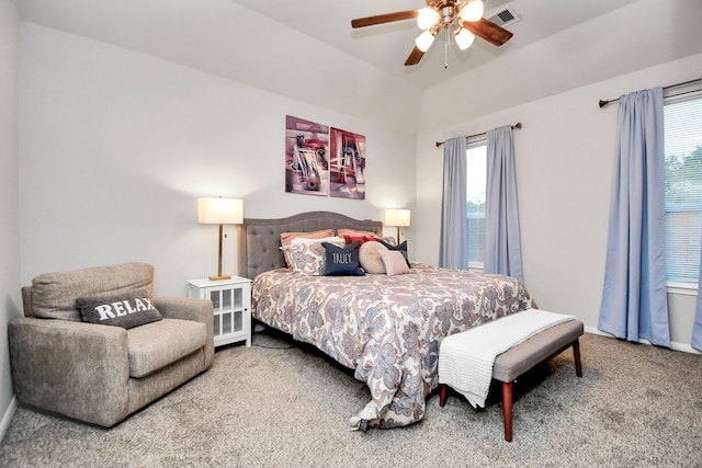 bedroom with visible vents, a ceiling fan, carpet flooring, vaulted ceiling, and baseboards