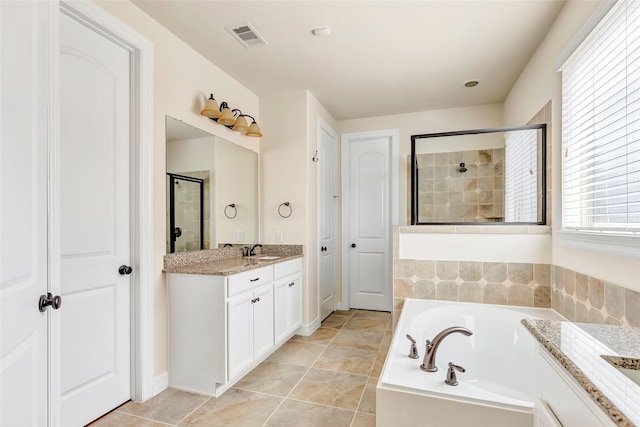 13006 Freemont Peak Ln, Humble, TX 77346 - full bath featuring vanity, a garden tub, a tile shower, and tile patterned floors