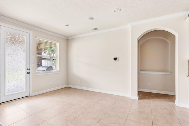 13006 Freemont Peak Ln, Humble, TX 77346 - spare room with light tile patterned floors, ornamental molding, baseboards, and a textured ceiling