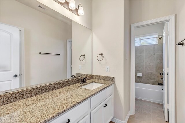 13006 Freemont Peak Ln, Humble, TX 77346 - full bath with vanity, tile patterned floors,  shower combination, and baseboards