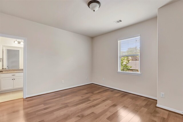 13006 Freemont Peak Ln, Humble, TX 77346 - spare room with light wood-type flooring and baseboards