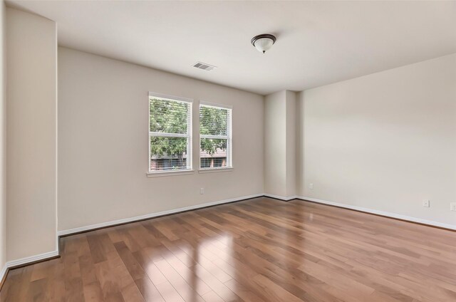 13006 Freemont Peak Ln, Humble, TX 77346 - empty room with wood finished floors and baseboards