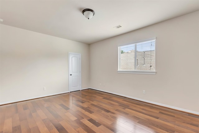 13006 Freemont Peak Ln, Humble, TX 77346 - spare room featuring wood finished floors and baseboards