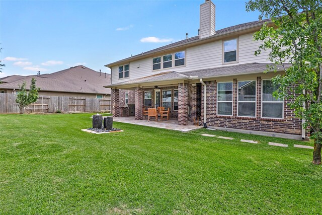 13006 Freemont Peak Ln, Humble, TX 77346 - rear view of property featuring brick siding, a chimney, a patio, and a ceiling fan
