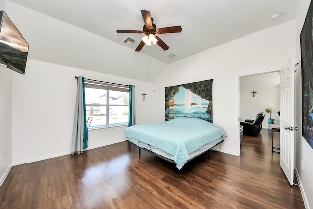 bedroom featuring dark wood-type flooring, lofted ceiling, visible vents, and baseboards