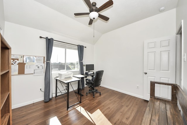 office space with dark wood-style floors, ceiling fan, baseboards, and vaulted ceiling