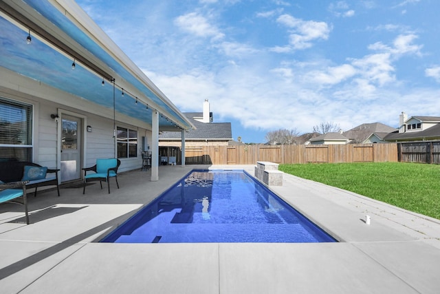 view of pool featuring a patio area, a fenced backyard, a fenced in pool, and a lawn