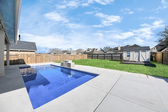 view of pool featuring a storage shed, a fenced backyard, a patio, and an outdoor structure