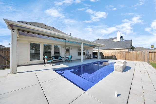 view of pool featuring a patio area and a fenced backyard