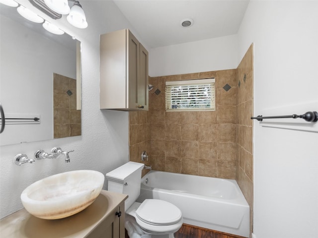 full bath featuring  shower combination, vanity, and toilet