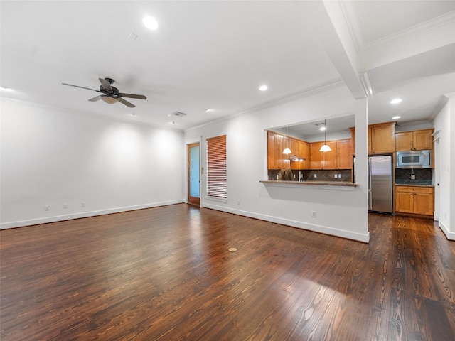 unfurnished living room featuring dark wood-style floors, baseboards, crown molding, and recessed lighting