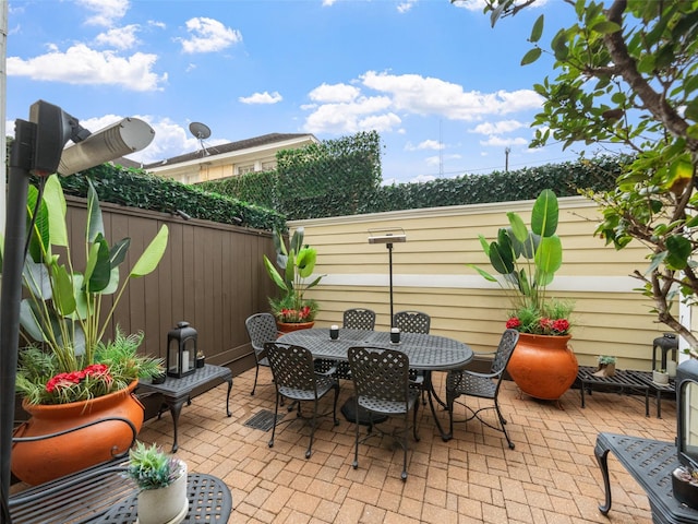 view of patio / terrace featuring fence and outdoor dining area